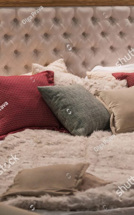 stock-photo-modern-room-interior-with-big-bed-cozy-room-in-bright-soft-colors-red-and-gray-pillows-and-a-1541557028